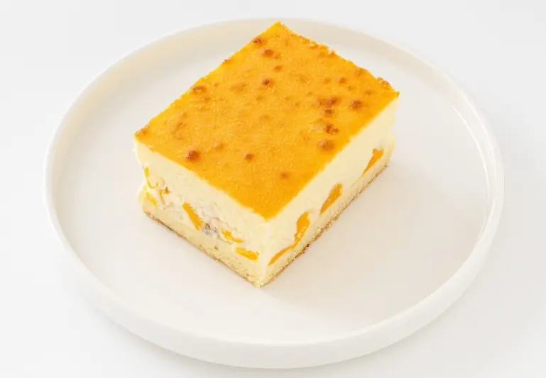 K&auml;sekuchen mit Pfirsich